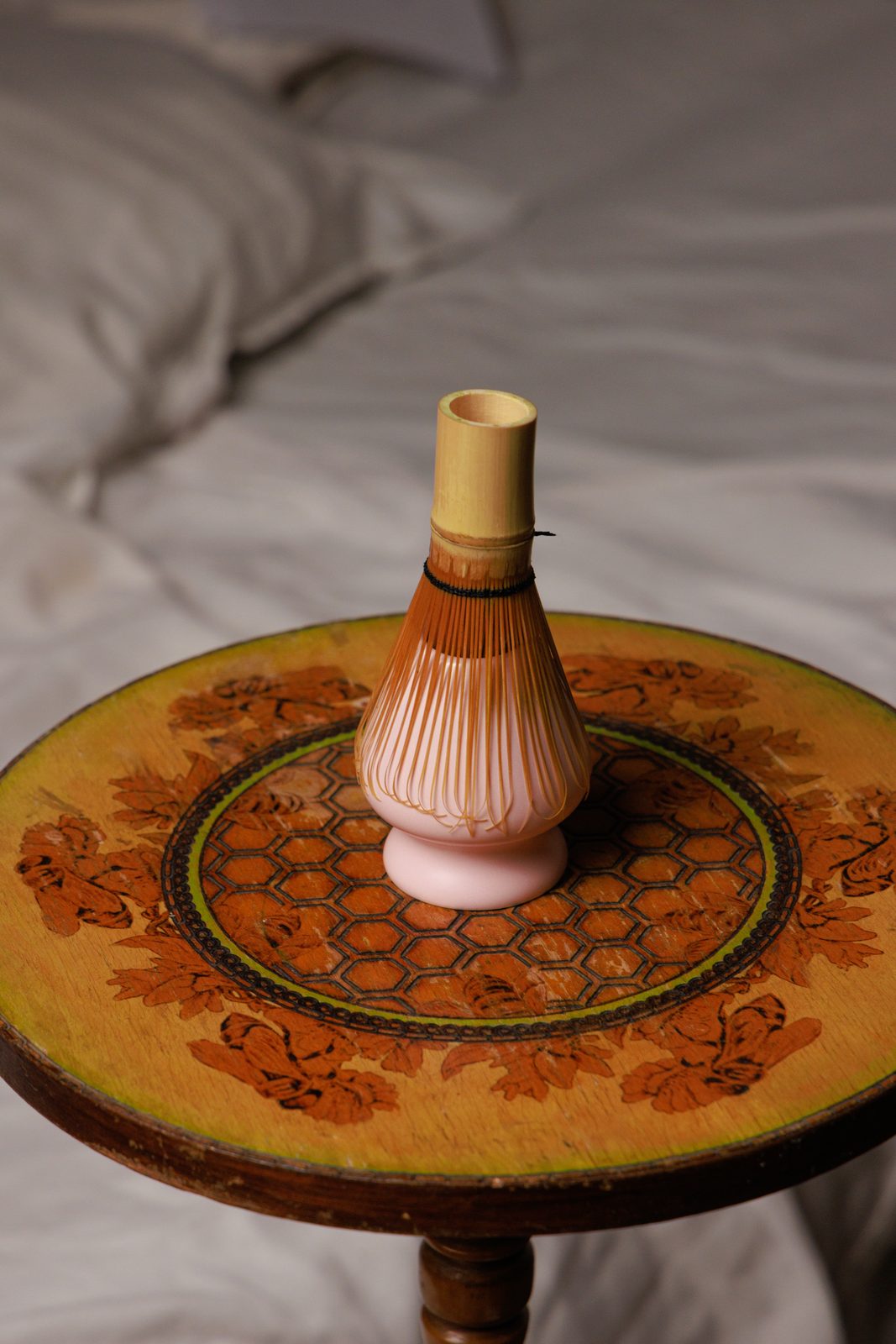 Bamboo whisk on an antique table